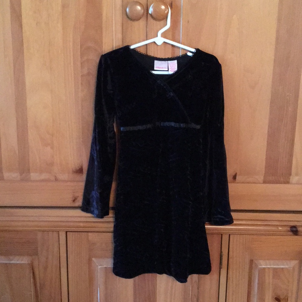 Black velvet dress with bell sleeves.Rose pattern